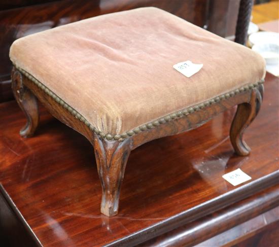 A simulated rosewood framed foot stool, upholstered in velvet, on moulded cabriole legs, W.36cm